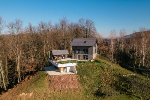 an aerial view of a house on a hill at Villa Diona in Loka pri Žusmu