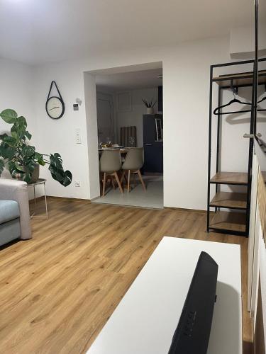 a living room with a couch and a table at Ferienwohnung Alecasa in Gailingen