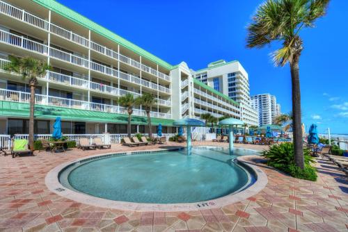 a swimming pool in front of a hotel at Daytona Beach Resort Condos in Daytona Beach
