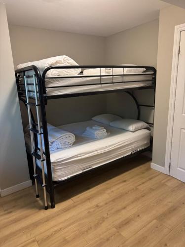 a couple of bunk beds in a room at chalet in blue mountain in Blue Mountains