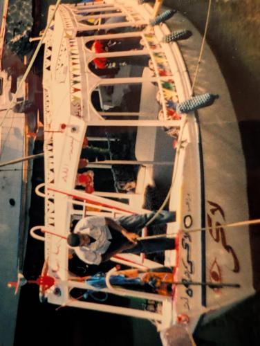 a group of people on a boat in the water at Lucky in Luxor