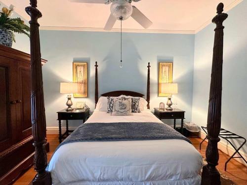 a bedroom with a large bed with two night stands at Bluebell Room in Oswego