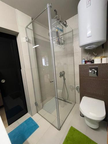 a bathroom with a shower and a toilet at Катедрала Варна in Varna City