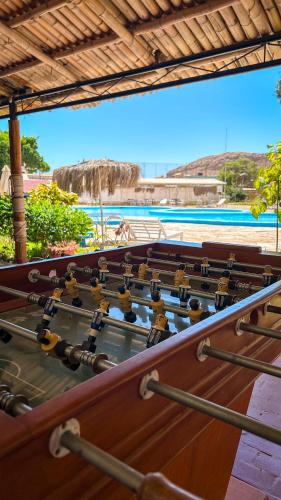 a close up of an old musical instrument in front of a beach at Hotel Pacífico Talara in Talara