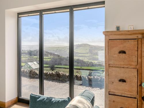 a room with a large window with a view at Kinder in Mellor