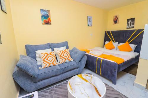 a living room with a couch and a couch at A&M Luxury bnbs in Nairobi