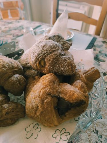 a pile of pastries sitting on a table at B&B Villa Adriano in Cavaion Veronese