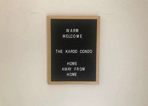 a framed picture on a wall with words on it at The Karoo Condo in Montagu