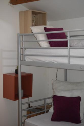 a couple of bunk beds in a room at A L ESCALE PASSA PAÏS in Le Poujol-sur-Orb