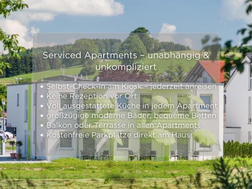 a sign in front of a house at Serviced Apartments, Selbst-Check-in in Amtzell