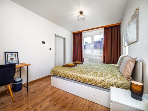 a bedroom with a bed and a window at Прайм, централен апартамент in Pleven