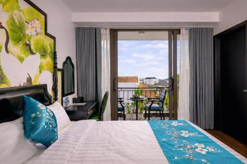 a bedroom with a bed and a balcony at Tam Coc Center Friendly Hotel in Ninh Binh
