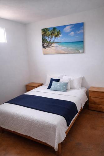a bedroom with a large bed with a view of the beach at Kaihalulu Beach Room - Punta Hermosa in Punta Hermosa