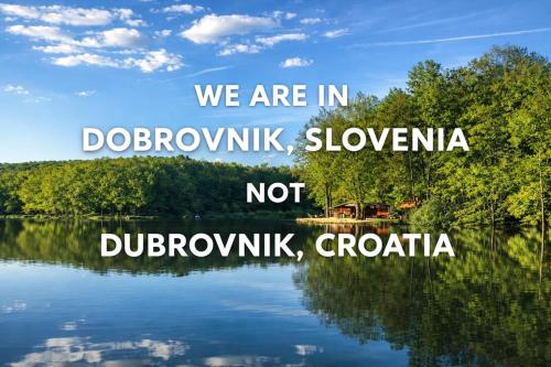 a picture of a lake with the words we are in doobynka at Hiša PRI JEZERU in Dobrovnik