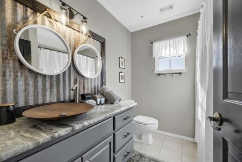 a bathroom with a sink and a mirror at Casa Blanca: Hot-tub, Fire Pit, Hill Country Views in Luckenbach