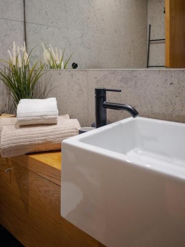 a bathroom sink with a faucet on a counter at Patio by the sea in Cruz Quebrada