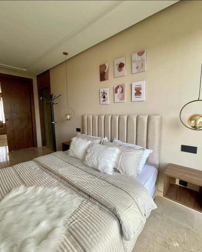 a bedroom with a large bed with white pillows at Tokyo in Maarif