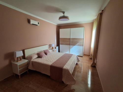 a bedroom with a bed with two pillows on it at Sol de Infantes in Villanueva de los Infantes