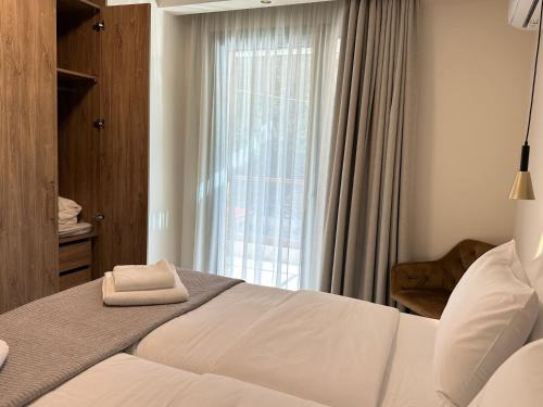 מיטה או מיטות בחדר ב-Panorama Serenity Suites