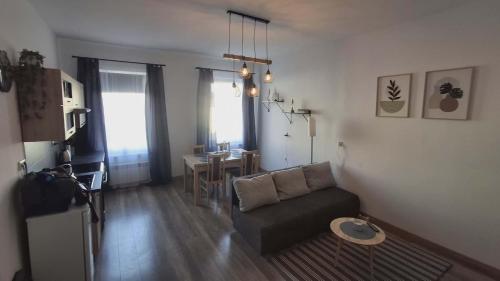 a living room with a couch and a table at Apartament Elizabeth in Głubczyce