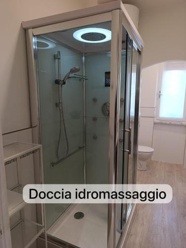 a shower with a glass door in a bathroom at Suite Cinque terre Portovenere in La Spezia