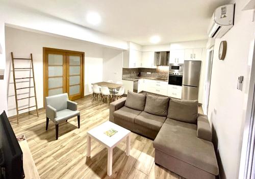 a living room with a couch and a table at CAMIÑO DA PRATA in Redondela