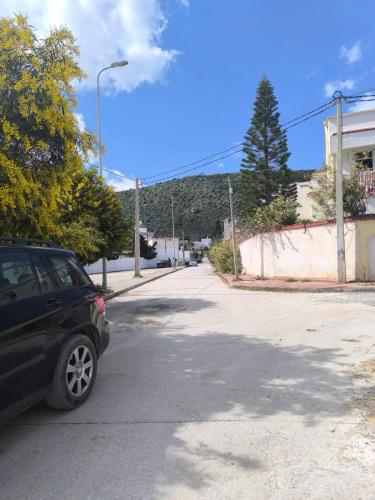 a black car parked on the side of a street at Bizerte Tunisia cozy studio in Bizerte
