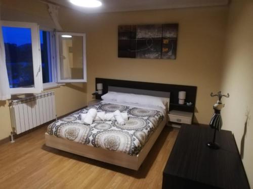 a bedroom with a bed with two pillows on it at Casa Pepe La Granda in Trasona