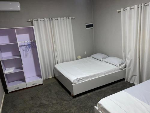 Llit o llits en una habitació de Augi's Rental