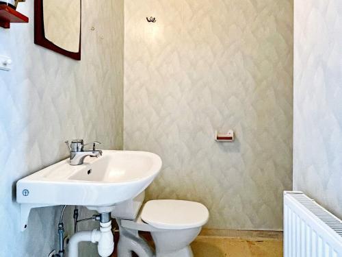 a bathroom with a sink and a toilet at 9 person holiday home in Mörlunda-By Traum in Mörlunda