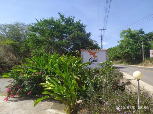 a sign for a cafe on the side of a road at Sea Natural in San Gil