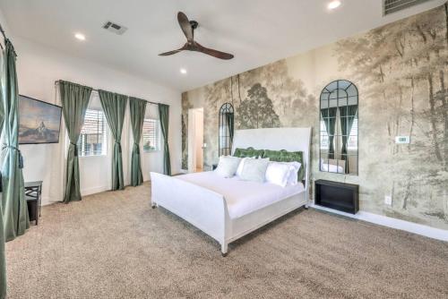 a bedroom with a white bed and a fireplace at CIELO - Modern Vegas Pool Oasis, Spa, Pickleball in Las Vegas