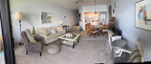 a living room with a couch and a table at Oceanfront with Private Beach! Hale Mahina Beach Resort A206 in Lahaina