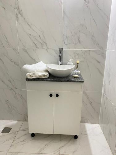 a bathroom with a white sink and a counter at Marías in Resistencia