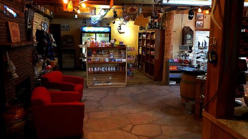a room with a store with red chairs and a counter at Historic Rail car on route 66 in Williams