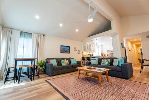 a living room with a couch and a table at Mission Casa Del Mar in San Diego