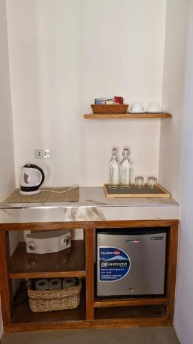 a kitchen with a counter with a sink and a dishwasher at yamba pacifico in San Isidro