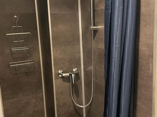 a shower with a glass door with a shower at Studio confortable - 4 pers. - API-1-52-2047 in Saint-Girons