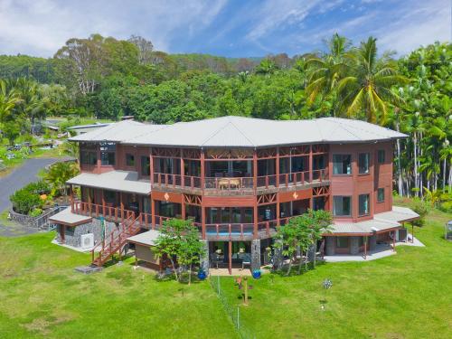 an aerial view of a large house with trees at Hawaii Magic Skies B&B Farmstay in Hilo