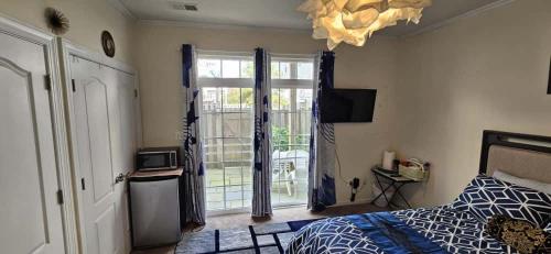 a bedroom with a bed and a large window at Single Room in Townhouse in Manassas