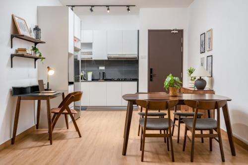a kitchen and dining room with a table and chairs at Casablanca Desaru in Desaru