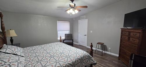 a bedroom with a bed and a ceiling fan at Spacious Private Room - Workspace - Las Cruces in Las Cruces