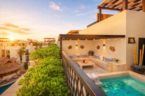 a villa with a swimming pool and a balcony at Casa Vibe PH- Private Rooftop - 3 Balcony - Pool in Tulum