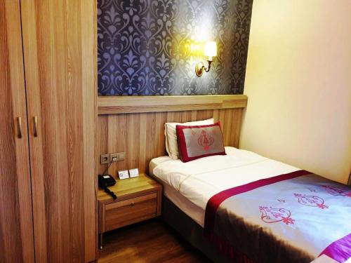 Postel nebo postele na pokoji v ubytování Dab Hotel