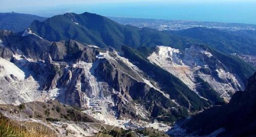 an aerial view of a rocky mountain with trees at Il Borgo della Colomba in Fosdinovo