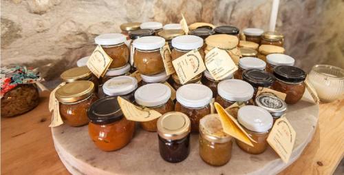a group of jars of honey on a table at Il Borgo della Colomba in Fosdinovo