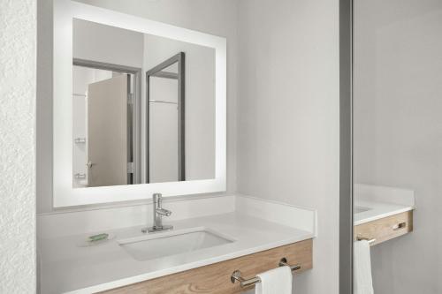 a bathroom with a sink and a mirror at SpringHill Suites by Marriott Morgantown in Morgantown