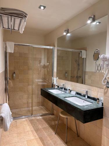 a bathroom with two sinks and a shower at Casa del Trigo in Santa Fe