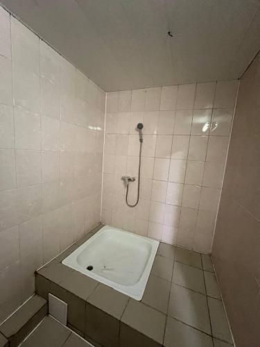 a bathroom with a shower with a tub in it at Оазис in Lutsk
