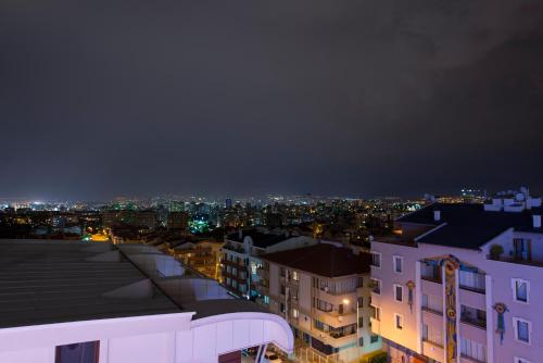 a view of a city at night with buildings at Park Inn by Radisson Ankara Cankaya in Ankara